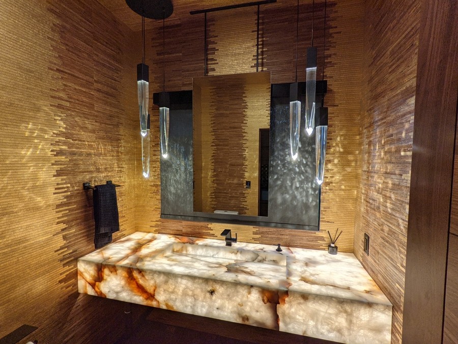 bathroom sink with backlit stone lighting.